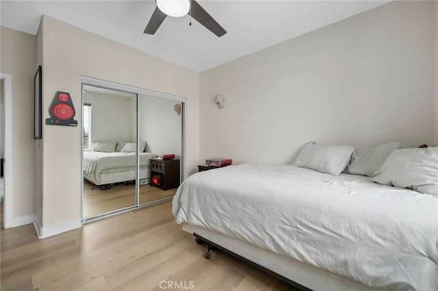 10983 Redwood Ave, Hesperia, CA 92345 - bedroom featuring light wood finished floors, a closet, a ceiling fan, and baseboards