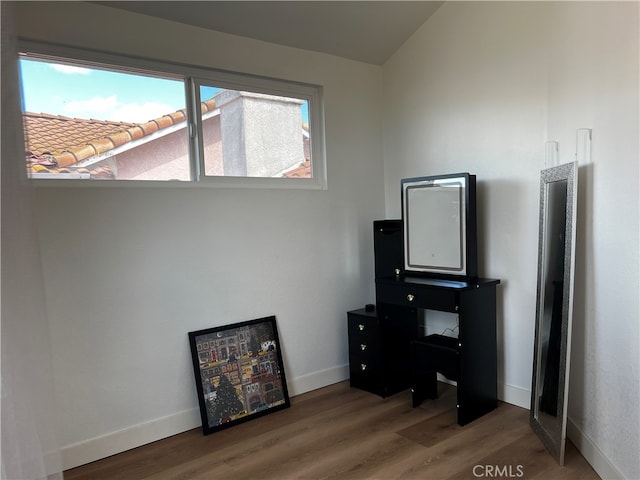 office area featuring baseboards and wood finished floors