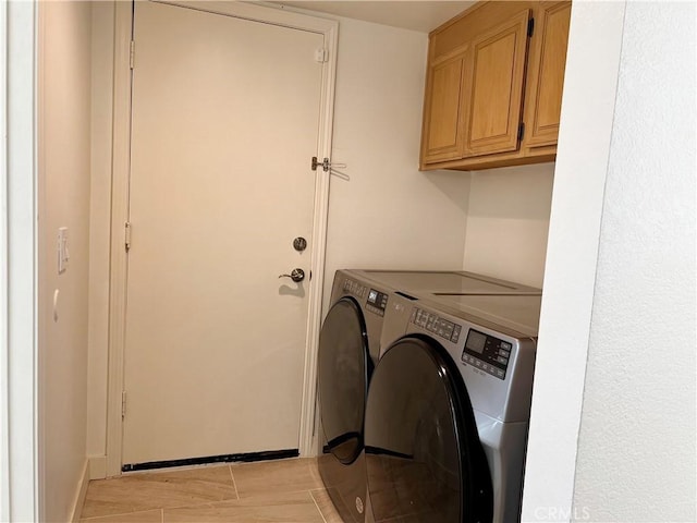 laundry area featuring cabinet space and washing machine and dryer