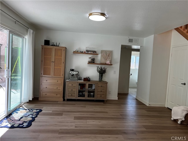 interior space with visible vents, baseboards, and light wood-style flooring