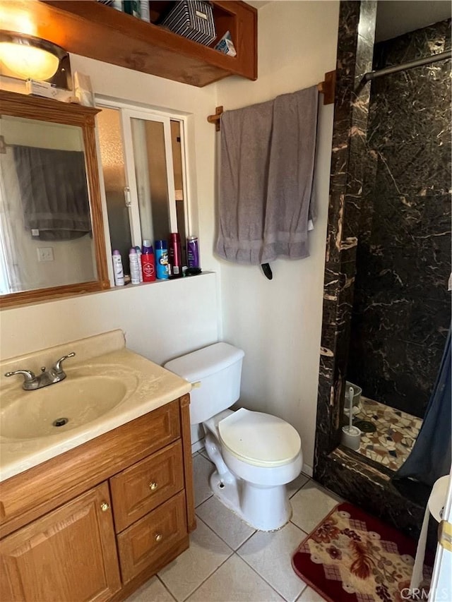 full bathroom featuring a marble finish shower, toilet, vanity, and tile patterned flooring