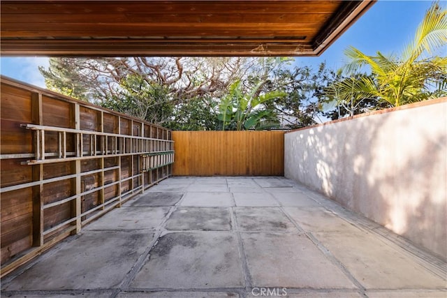 view of patio / terrace featuring fence