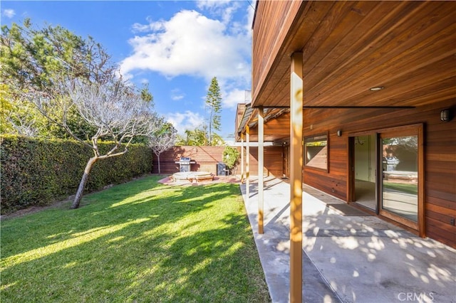 view of yard with a patio and a fenced backyard