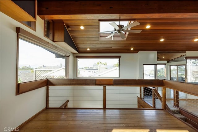 interior space featuring ceiling fan, plenty of natural light, lofted ceiling, and hardwood / wood-style floors