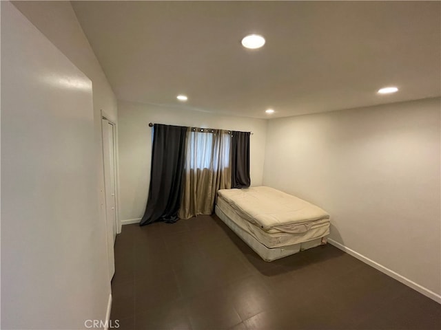 bedroom featuring recessed lighting and baseboards