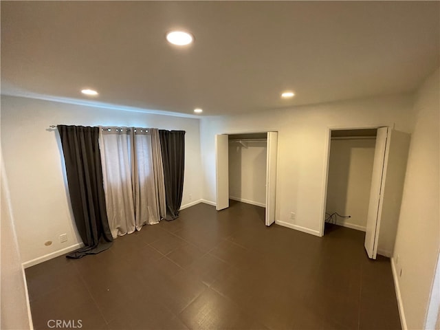 unfurnished bedroom featuring recessed lighting and baseboards