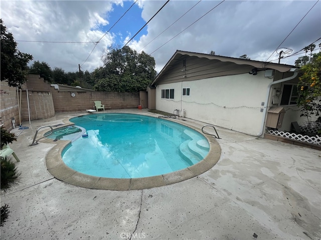 view of pool with a fenced in pool, a patio, and a fenced backyard