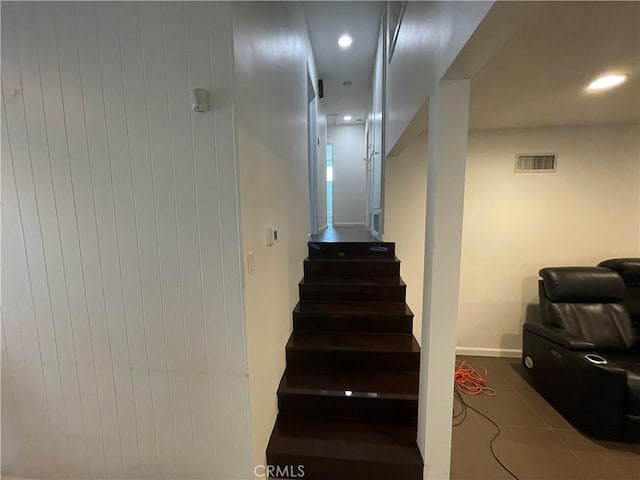 stairway featuring tile patterned flooring, recessed lighting, visible vents, and baseboards