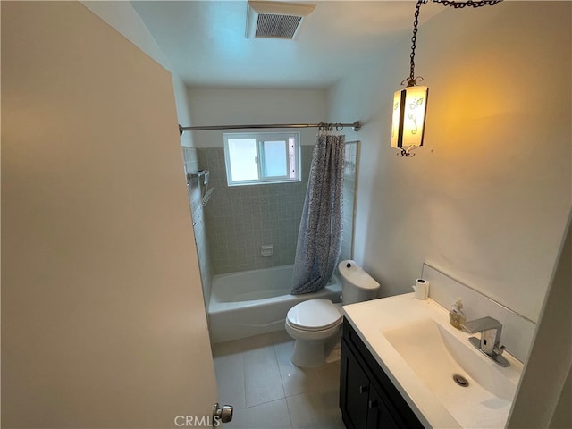 bathroom with vanity, visible vents, shower / bath combo with shower curtain, tile patterned floors, and toilet