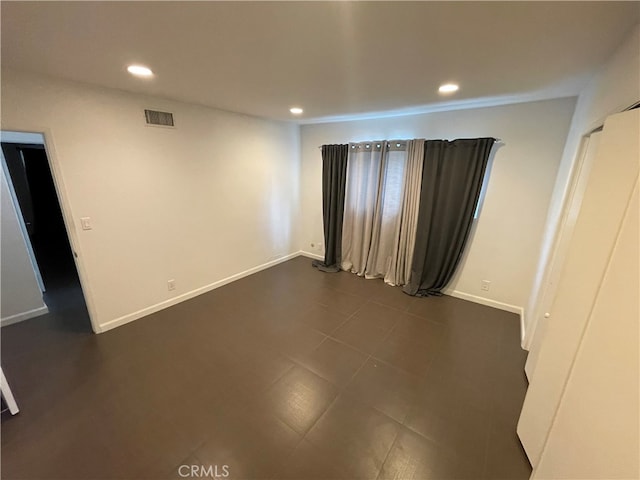 unfurnished bedroom with recessed lighting, visible vents, and baseboards