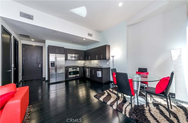 dining room featuring recessed lighting, visible vents, and dark wood-style flooring