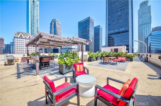 view of patio with a city view, a pergola, and a grill