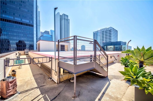 exterior space with a city view and a balcony