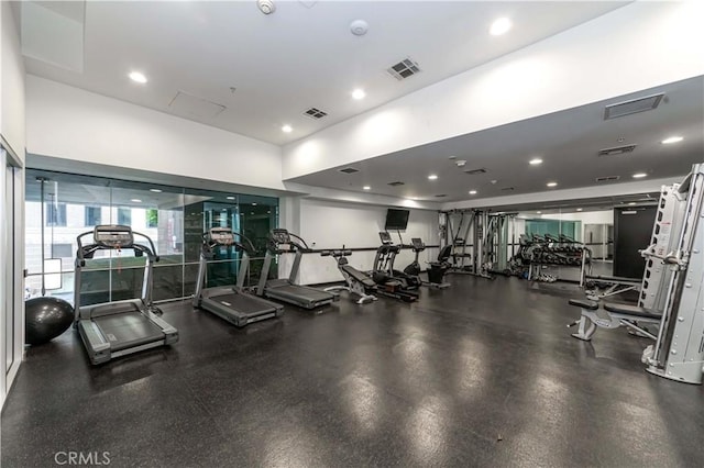 exercise room featuring recessed lighting and visible vents