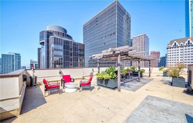 view of patio with a view of city and a pergola