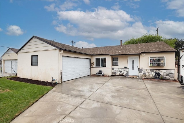 ranch-style home featuring a garage, stucco siding, concrete driveway, and a front lawn