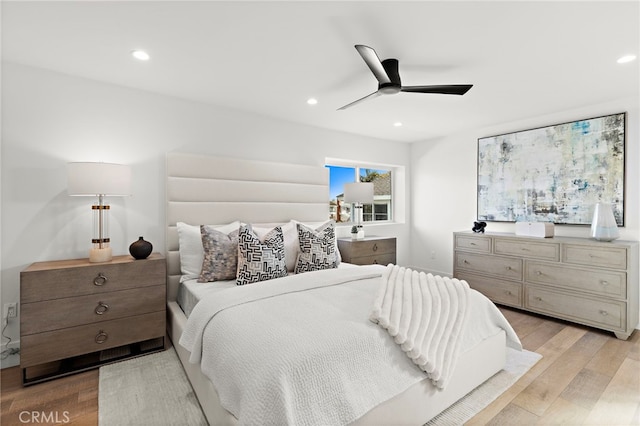 bedroom featuring recessed lighting, a ceiling fan, and light wood-type flooring
