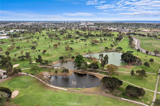 drone / aerial view featuring a water view and golf course view