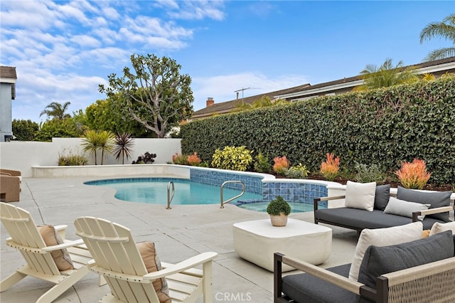 view of pool featuring a fenced in pool, a fenced backyard, outdoor lounge area, and a patio area