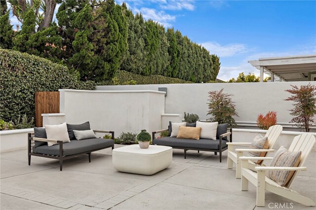 view of patio with outdoor lounge area and fence