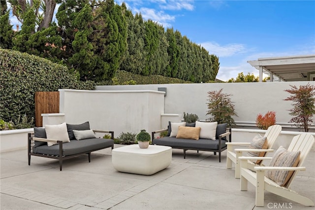 view of patio / terrace featuring fence and outdoor lounge area