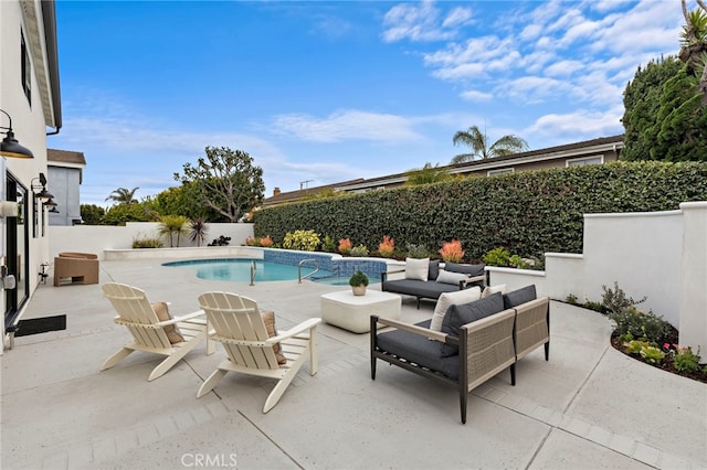 view of swimming pool featuring a patio, a fenced backyard, a fenced in pool, and an outdoor hangout area