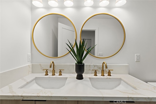 room details featuring double vanity and a sink