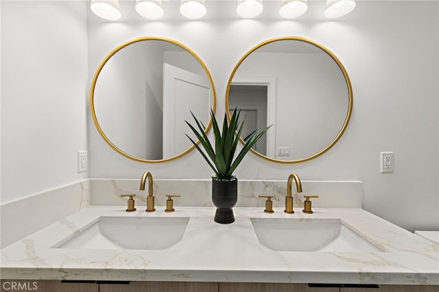 bathroom with double vanity and a sink