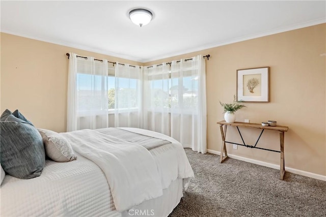 carpeted bedroom featuring baseboards and ornamental molding