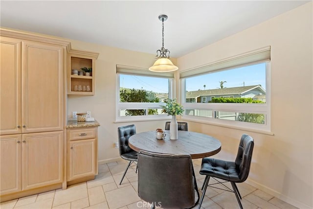 dining area featuring baseboards