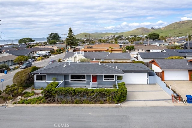 birds eye view of property featuring a mountain view and a residential view