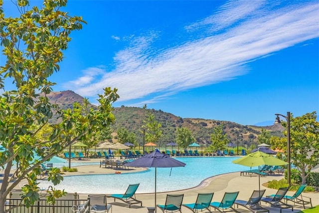 view of pool featuring a patio area and a mountain view