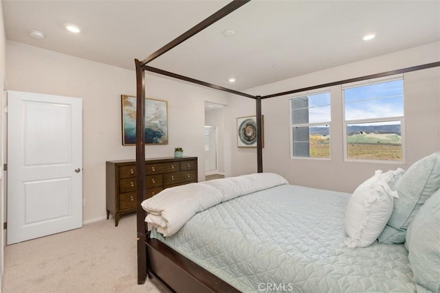 bedroom with recessed lighting and light carpet