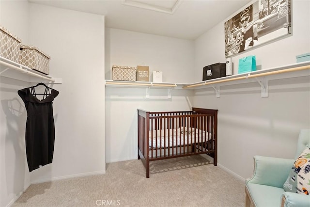 walk in closet featuring carpet