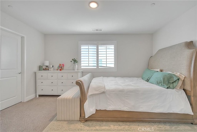 bedroom with light carpet and visible vents