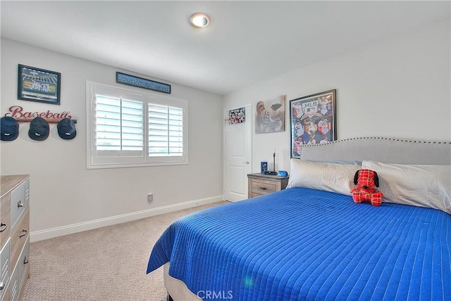 carpeted bedroom with baseboards