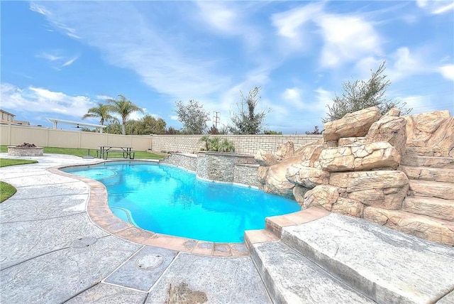 view of pool featuring a fenced in pool, a patio, and a fenced backyard