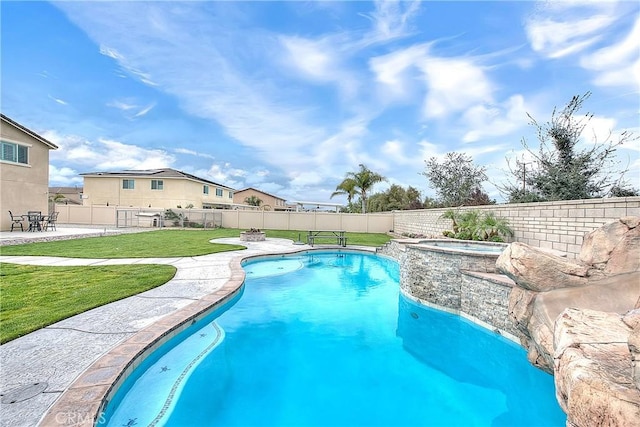 view of swimming pool with a fenced in pool, a lawn, a fenced backyard, a patio area, and an in ground hot tub