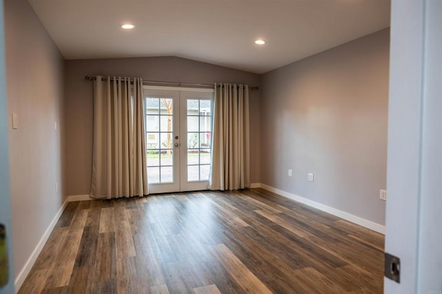 unfurnished room featuring baseboards, dark wood finished floors, lofted ceiling, recessed lighting, and french doors