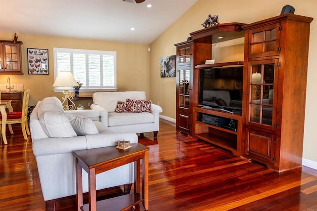 living room with lofted ceiling, recessed lighting, dark wood-style flooring, and baseboards