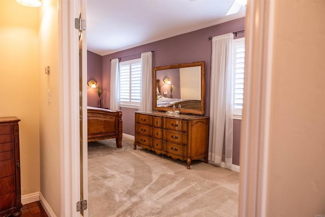 bedroom with carpet flooring and baseboards