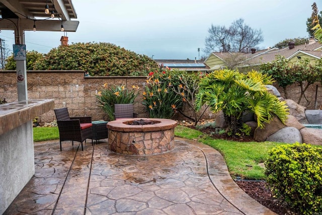 view of patio / terrace with a fire pit