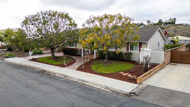 single story home with fence