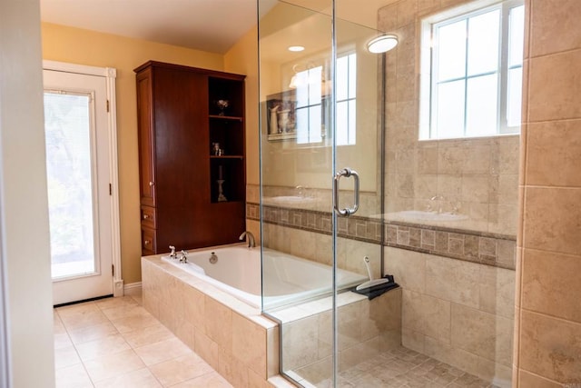 full bathroom with a bath, a shower stall, and tile patterned flooring