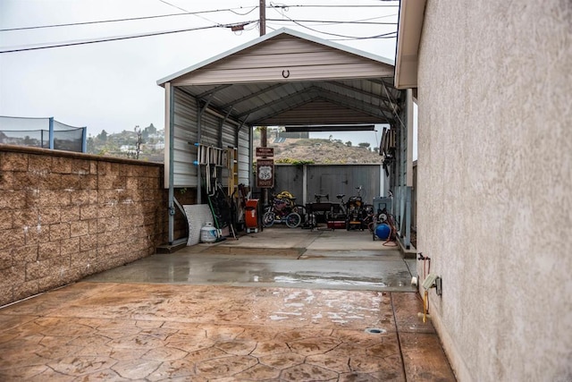 view of car parking with a carport and driveway