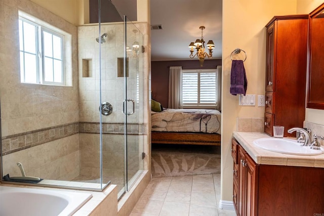 bathroom with visible vents, a notable chandelier, a stall shower, and ensuite bathroom