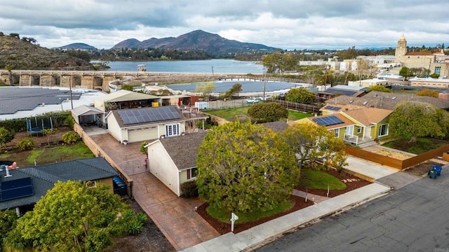 birds eye view of property featuring a water and mountain view