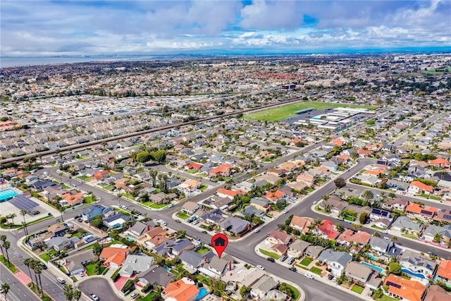 birds eye view of property with a residential view