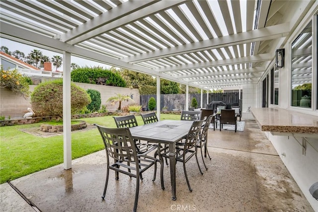 view of patio / terrace with a fenced backyard, outdoor dining space, and a pergola