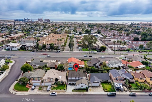 birds eye view of property featuring a residential view and a water view